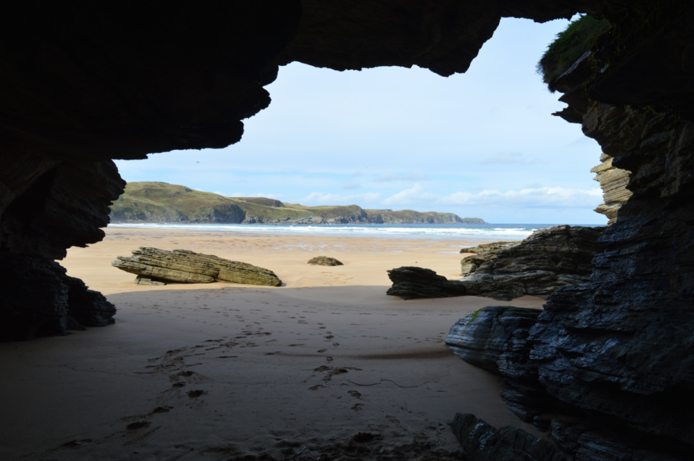 Far North - Strathy : View from within a cave looking out onto the beach. 
